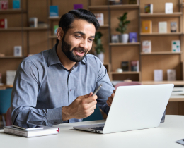 Person using laptop in professional setting